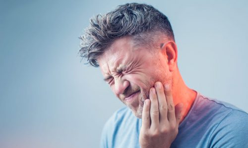 Man_in_Pain_Holding_His_Jaw_West_Hartford_CT_Dentist-1366x911